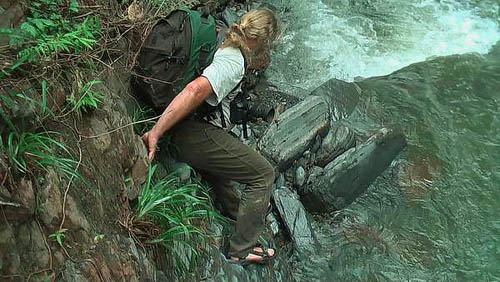 Lars Andersen on the rocky edge of rapid stream, Caranavi, Yungas. d. 27 january 2010. Photographer: Peter Mllmann